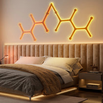 Soho Art Lighting: Modern Geometric Wooden Wall Lights With Warm Glow in a Bedroom Setting.