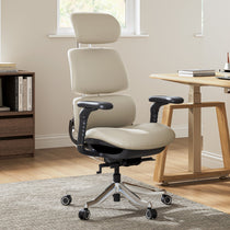 Eureka Ergonomic Light beige Forma ergonomic executive office chair with adjustable headrest and armrests in a home office setting.