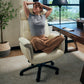 Woman Relaxing in Royal Microfiber Leather Executive Office Chair. Ergonomic Design for Comfort.