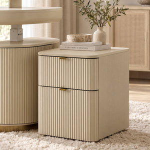 Eureka Ergonomic Opal fluted file cabinet in Cream styled on a shag rug with books and an olive branch vase