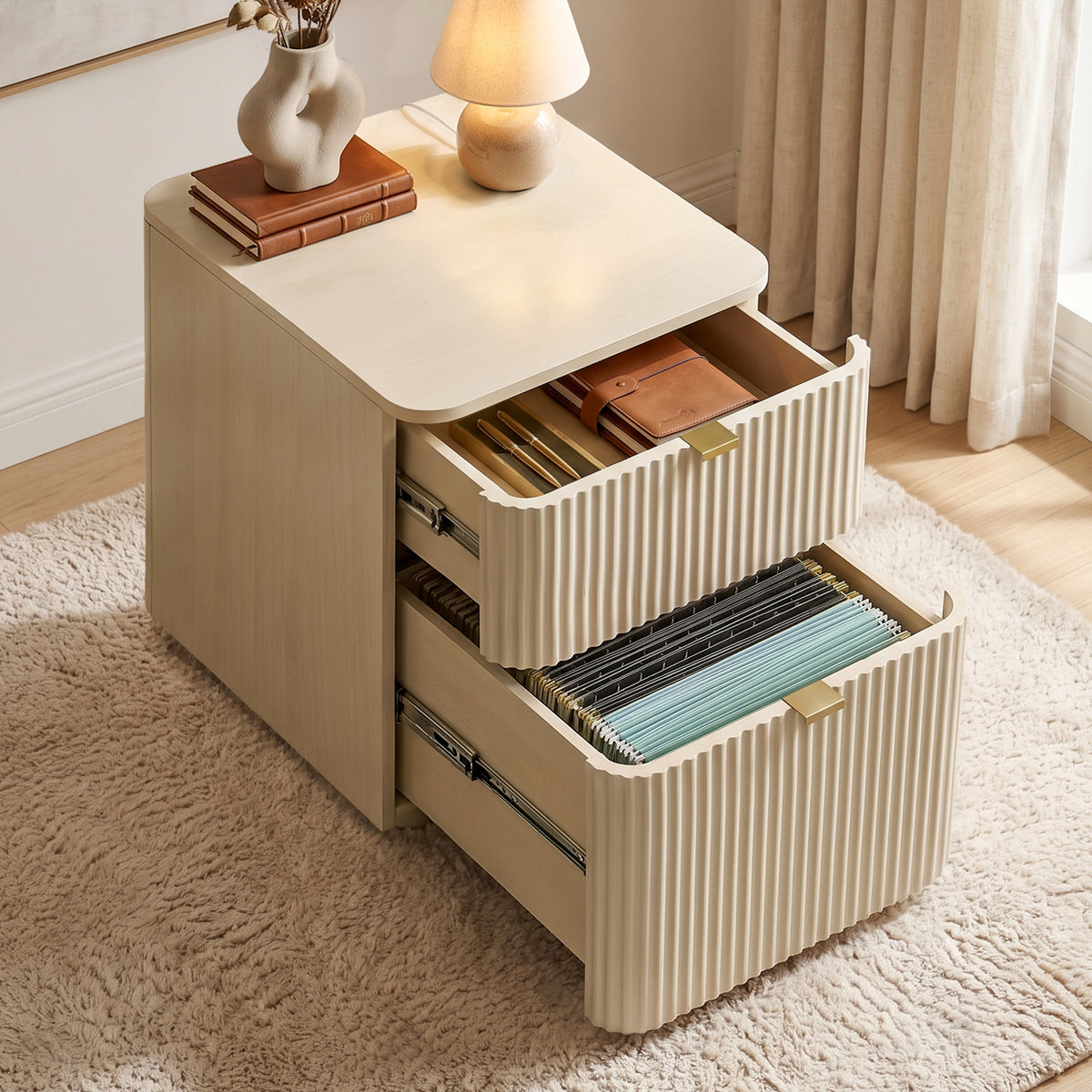 Eureka Ergonomic Opal file cabinet with both drawers open, hanging file folders below and a leather folio above