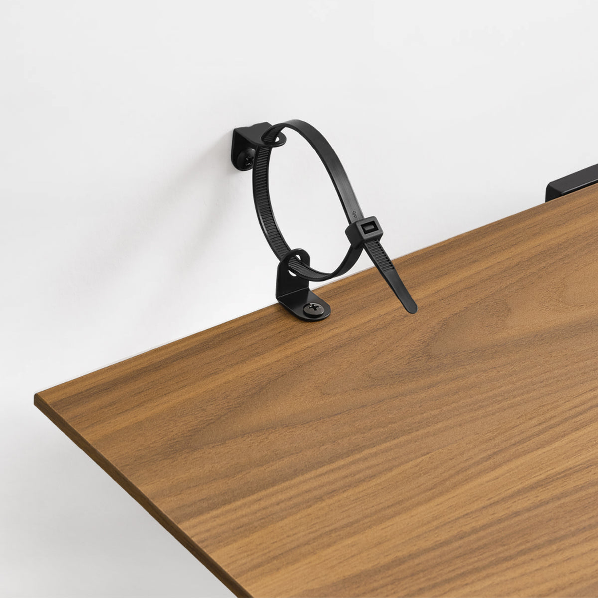 Eureka Ergonomic Ark 78 inch walnut bookshelf with close-up of the anti-tip device attached to the shelf