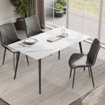 Liam 55.91 White Sintered Stone Dining Table With Black Legs and Gray Chairs in a Modern Dining Setting.
