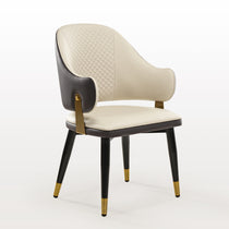 Anareli Upholstered Dining Arm Chair in Beige and Dark Brown Faux Leather With Gold Accents.