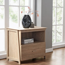 Wooden Nightstand With Fall Ficus Branches Decor. Home Decor With Light Wood and Natural Touch.