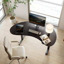 Eureka Ergonomic Cashew Shape Standing Desk With Ergonomic Chair in Home Office Setting.