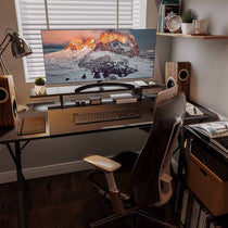 Ergonomic Workspace With Carbon Fiber Dual Monitor Stand and Modern Accessories for Comfortable Home Office Setup.
