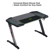 Black Gaming Desk With Integrated Mouse Pad, Ergonomic Design, and Led Lights, Offering Sleek Comfort.