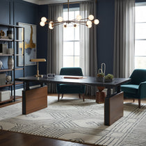 Eureka Ergonomic Zen Pro Executive Standing Desk with Sintered Stone top in a sophisticated home office with teal chairs.