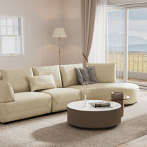 Beige Leather Leah Curved Couch Sofa in Modern Living Room, Minimalist Design.