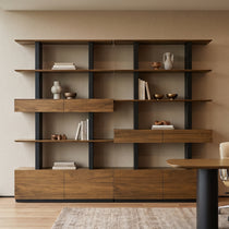 Eureka Ergonomic Ark 78 inch walnut bookshelf with drawers and display shelves in a conference room