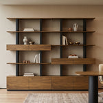 Eureka Ergonomic Ark 78 inch walnut bookshelf with drawers and display shelves in a conference room