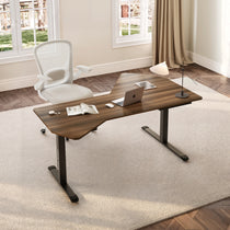 Eureka Ergonomic Blossom Dynamics 70" L-shaped standing desk in dark wood grain with laptop, book, earbuds, and tablet in a home office.