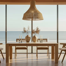 Eureka Ergonomic Edora Oak Extendable Dining Table with minimalist design and clean lines, set in a dining room with ocean view.