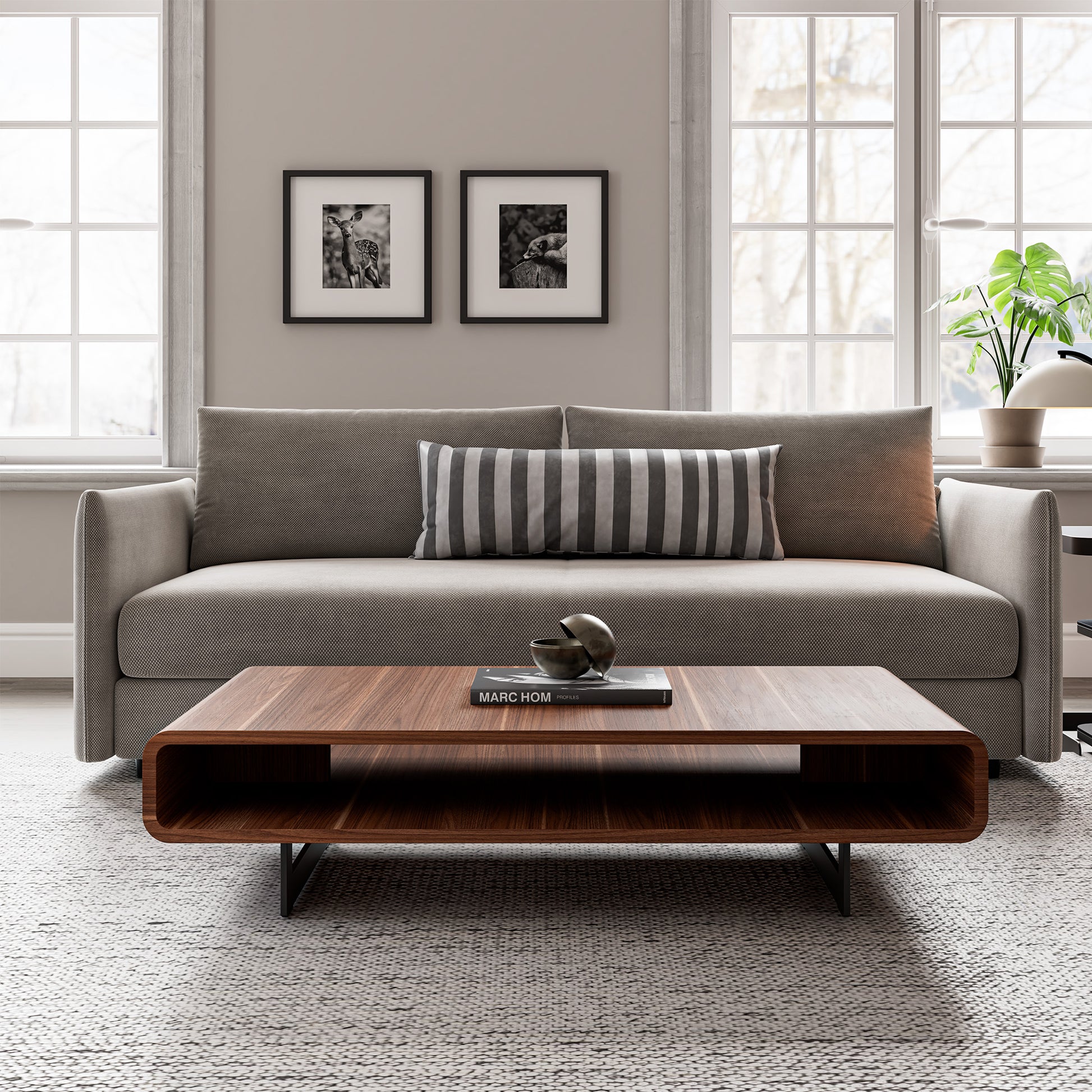 Eureka Ergonomic 47" Walnut Rounded Rectangular Coffee Table in the living room