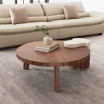 41 Irregular Round Walnut Coffee Table With Marble Accent and Solid Wood Details in a Living Room Setting.