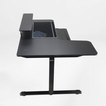 Eureka Ergonomic Maple L-shaped gaming standing desk with monitor riser, pull-out keyboard tray, and mousepad.