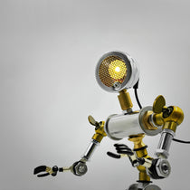HD-19 Robot-Shaped Cyberpunk Table Lamp Decor, Industrial Design With Metallic and Brass Accents, Illuminated.