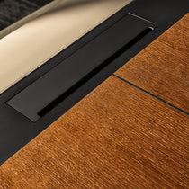 Eureka Ergonomic Zen Lunar executive desk close-up: rich wood grain, beige leatherette inlay, black metal accents. Materials detail.