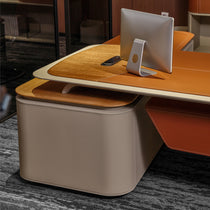 Eureka Ergonomic Zen Altair executive gaming desk with natural wood, tan leather inlay, orange side panel and computer.