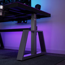 Eureka Ergonomic GTG-L60 Pro L-shaped gaming desk with adjustable height and purple ambient lighting, showcasing modern design.