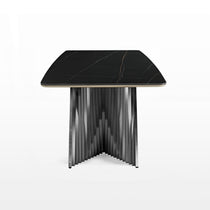 Eureka Ergonomic Oasis black sintered stone dining table, white & gold veining, curved edge, brushed metal fluted pedestal base.