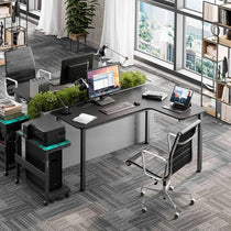 Eureka Ergonomic L-Shaped Office Desk Setup With Triple Monitors, Laptop, and Ergonomic Chair in a Modern Office.