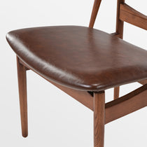 Brown Leather Dining Chair Detail. Mid-Century Modern Solid Wood Dining Chair.