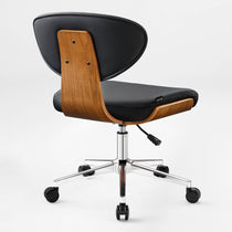 Eureka Ergonomic Matt black faux leather office chair with curved walnut veneer shell and chrome base on casters.