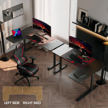 Black L-Shaped Gaming Desk With Triple Monitors, Gaming Chair, and Cable Management for Ergonomic Gaming Setup.