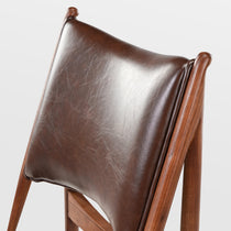 Brown Leather Dining Chair Back Detail, Mid-Century Modern Design, Ash Wood Frame.