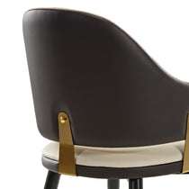 Anareli Dining Chair Detail: Dark Brown Faux Leather Back With Gold Accents and Cream Seat.