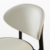 Off-White Leather Cedar Dining Chair Back Detail, Dark Wood Frame, Part of a Modern Dining Set.