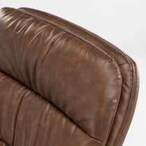 Close-Up of Brown Pu Leather Home Office Chair Headrest, Showcasing Texture and Stitching Details.