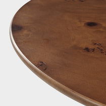 43 Brown Round Coffee Table Detail - Brown Wooden Veneer Surface With Natural Wood Grain and Smooth Edge.