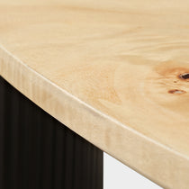 Detailed View of Birch Wood Veneer Coffee Table Surface Showing Wood Grain and Dark Base.