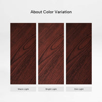 Eureka Ergonomic Ark ES Executive Standing Desk mahogany veneer color variation under warm, bright, and dim light.