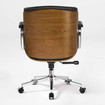 Eureka Ergonomic black Mathias Mason low back office chair shown from the rear with its walnut shell