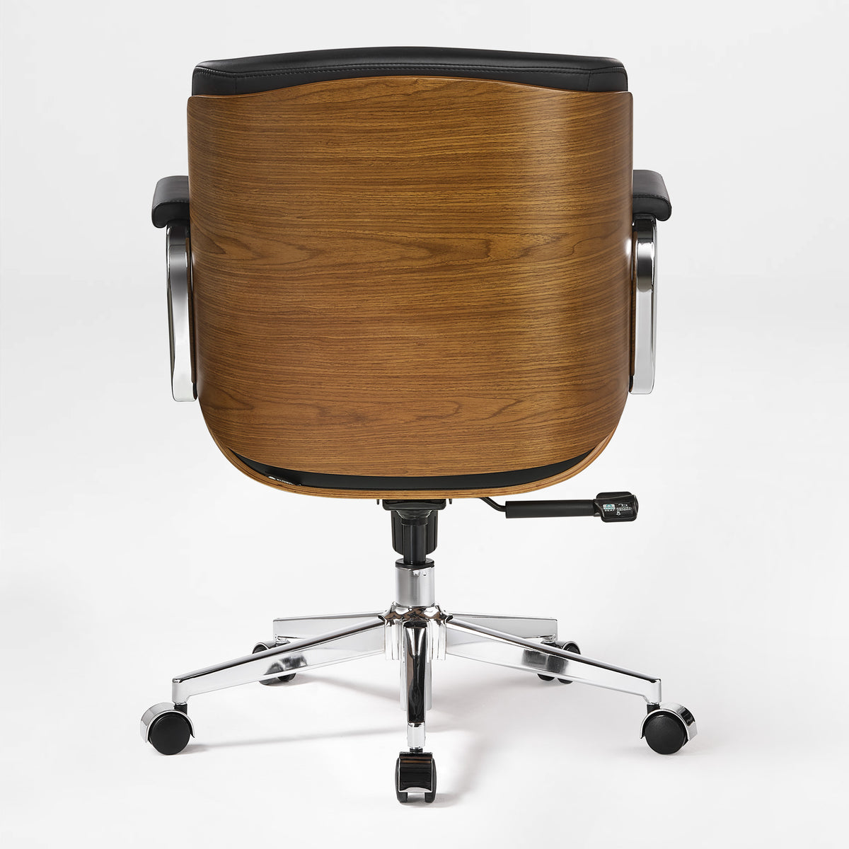 Eureka Ergonomic black Mathias Mason low back office chair shown from the rear with its walnut shell