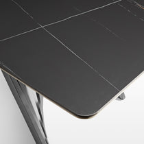 Eureka Ergonomic Oasis 105.5" dining table, dark gray sintered stone top with subtle white veining, close-up detail.