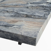 Close-Up of Marble Coffee Table Surface With Dark Gray Veining. Features a Black Leg.