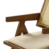 Eureka Ergonomic Close-up of Mila walnut dining chair armrest, woven rattan back detail and cream cushion.