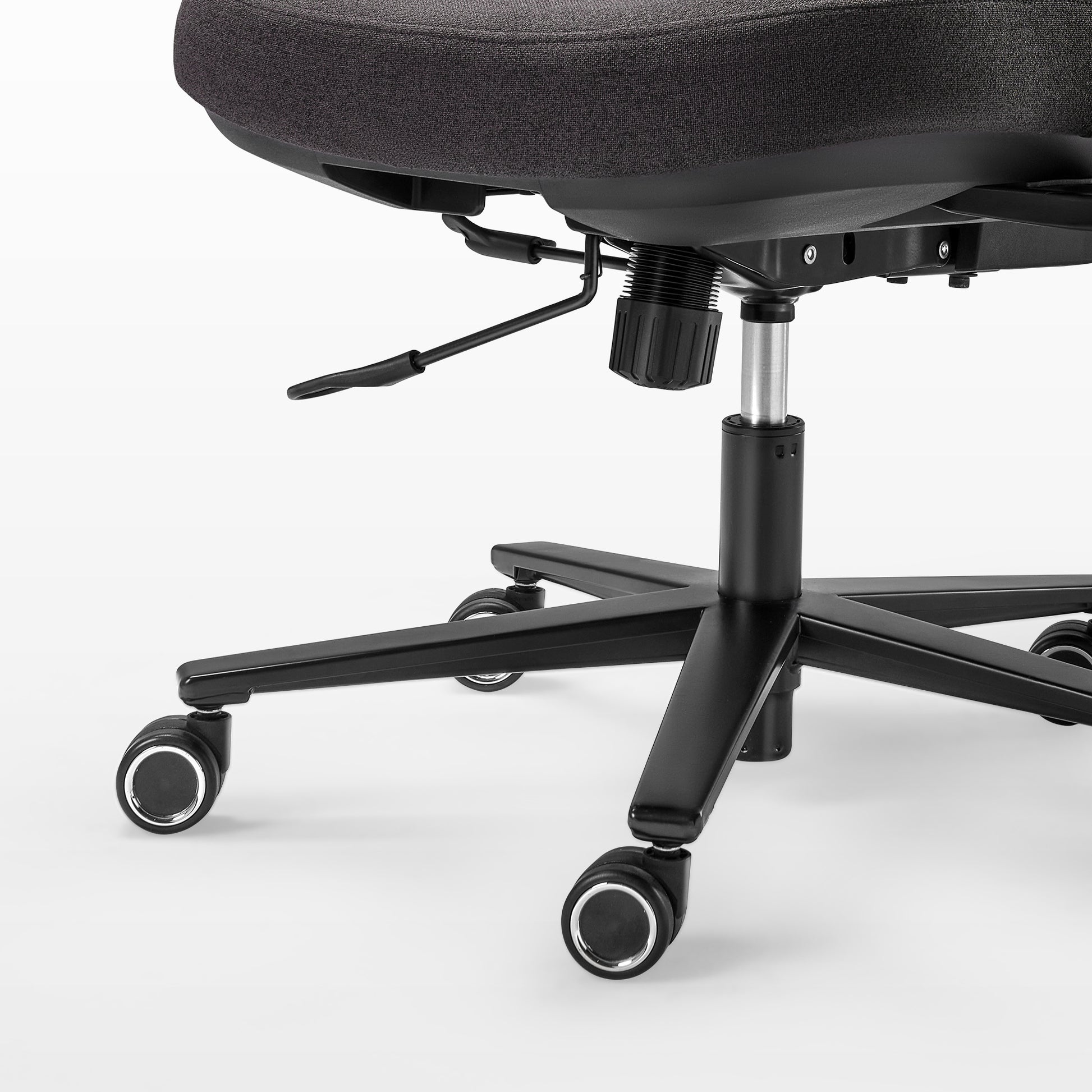 Close-up of a black office chair with wheels on a white background,black