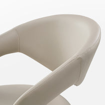 Chantilly Dining Chair Back Detail in Cream Faux Leather, Showcasing Stitching and Curved Design.