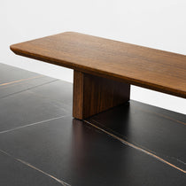 Eureka Ergonomic Ark Pro Desk Detail. Black Sintered Stone Top With Wood Accents and Support Structure, Gold Vein Design.