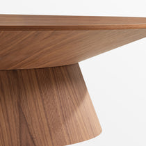 51 Walnut Oval Coffee Table - Close-Up Detail of Walnut Veneer and Curved Base Design.