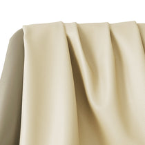 Close-Up of Beige Leather Leah Curved Sofa, Showing Detailed Texture and Drape.