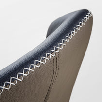 Elysian Blue Dining Chair Detail, Close-Up On the Gray Pu Leather Backrest With White Stitch.