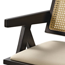 Eureka Ergonomic Black Mila rattan dining chair, handwoven back detail, cream seat cushion & mid-century armrest.