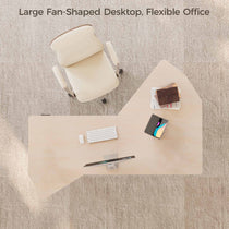 Top-Down View of a Fan-Shaped Office Standing Desk With Workspace Setup, Including Monitor, Keyboard, and Chair.